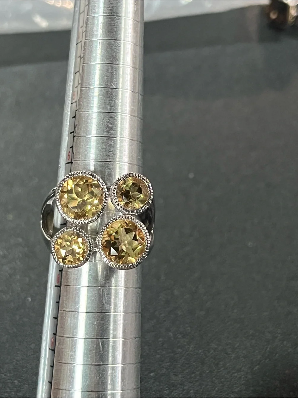 Sterling silver ring w/ 4 citrine gemstones. Sz 7. Pretty, unique design. 925